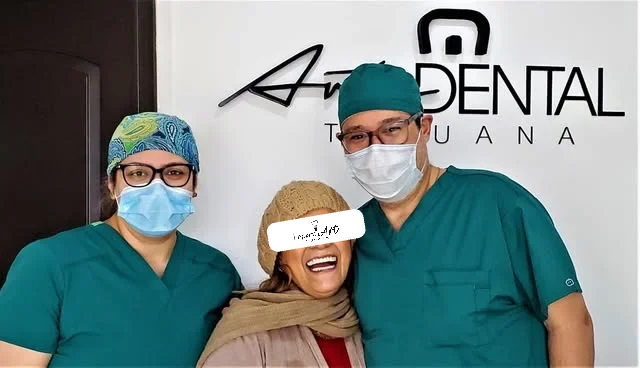 Our implant team with a happy patient